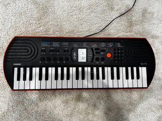 Casio SA 76 keyboard and adopter