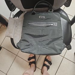 Unisex baggalini carrying bag with zippers and shoulder strap