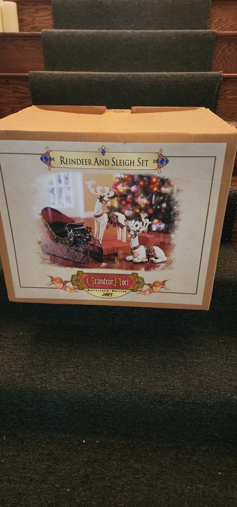 Metal Sleigh with porcelain Reindeer