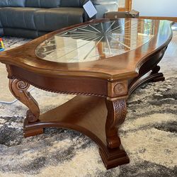 Elegant wood coffee table with beveled glass top
