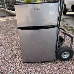 small whirlpool refrigerator / Nellis and Owens 