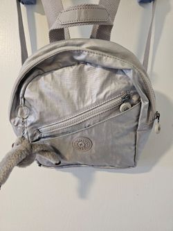 Kipling metallic silver mini backpack