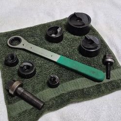 The "Slug-Buster" punch profile is designed to split the material slug in half, allowing it to fall freely for easy removal. The set includes punches 