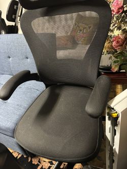 Black ergonomic mesh office chair