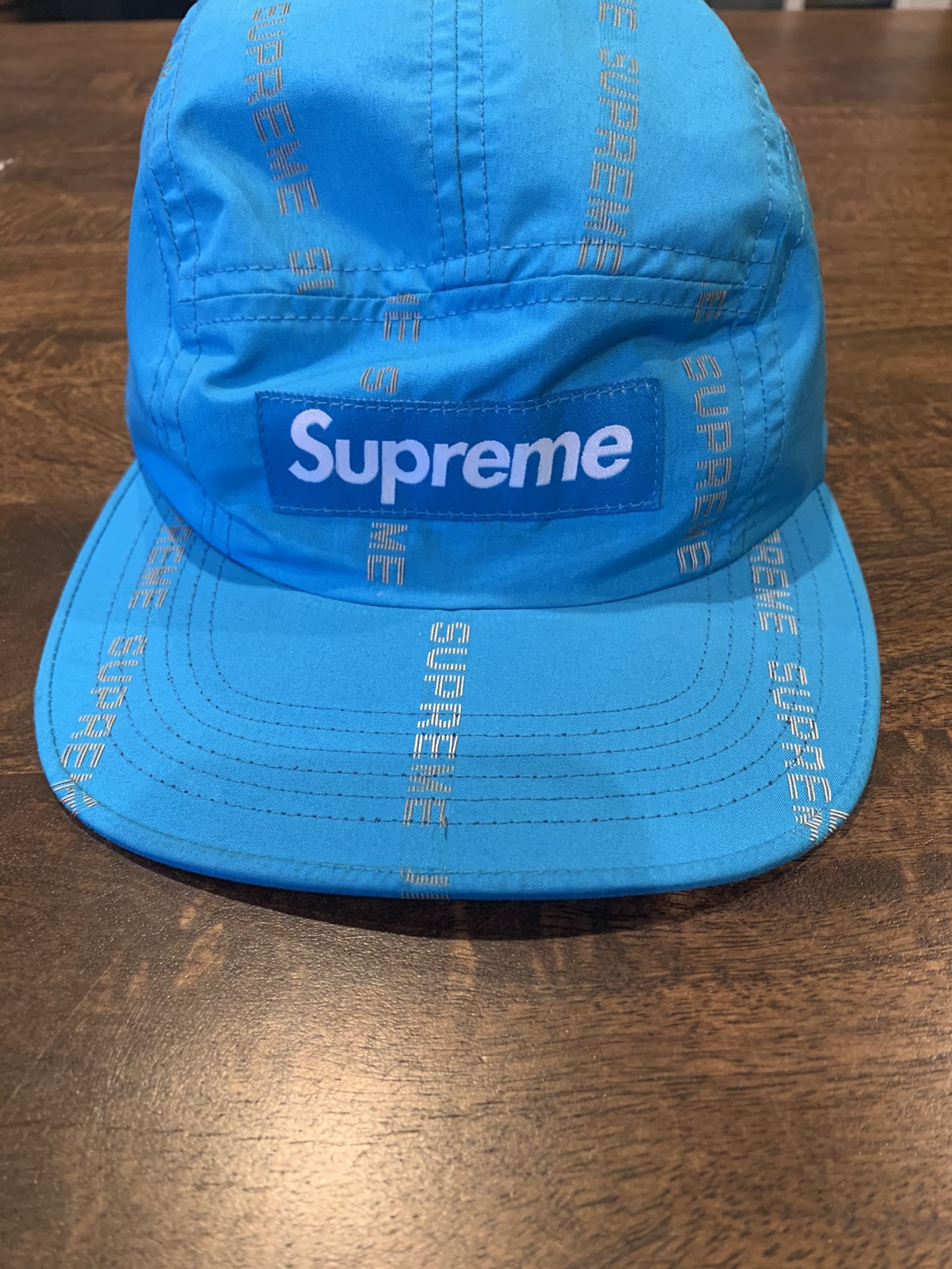 supreme blue reflective hat