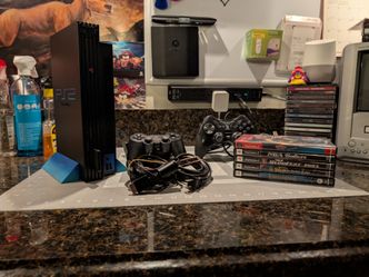 PlayStation 2 Bundle! 2 Controllers 5 games and A Memory Card