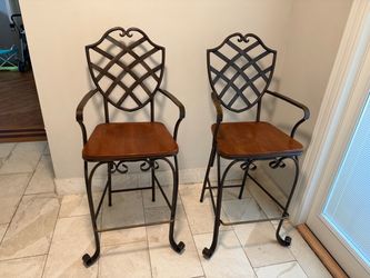 Two brown bar chairs must go