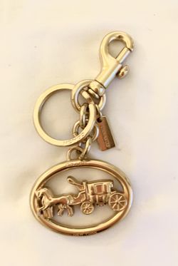 COACH , gold horse and carriage, key charm and keychain