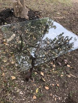 Glass and iron coffee table