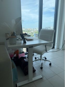Stand up desk with chair, monitor, and keyboard