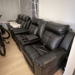 Two Black Reclining Couches