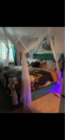Green Upholstered King Bed Frame with Added Canopy poles