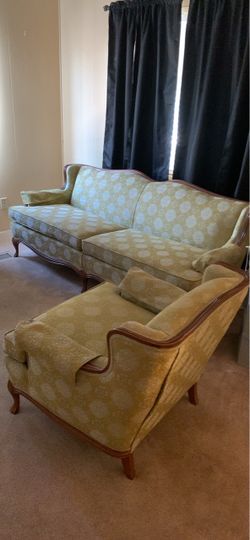 1940’s French Provincial style cabriole wood sofa and chair featuring light green damask patterned upholstery and an elegant exposed wood trim