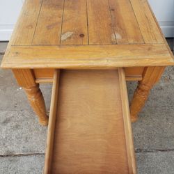 Heavy wood coffee table - 24"w x 27"d x 21”h with deep drawer in the front