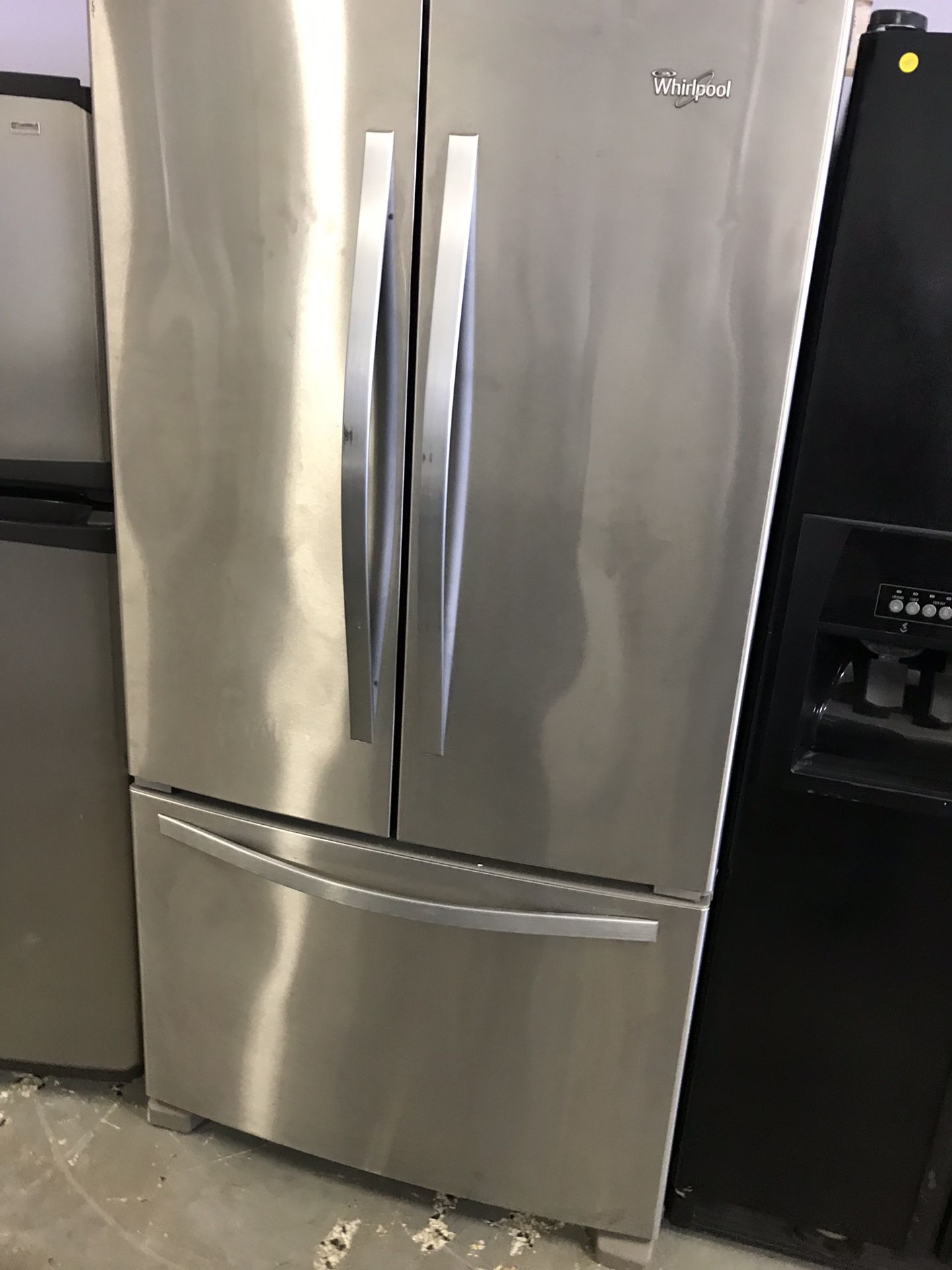 Whirlpool brand refurbished stainless steel 36” French door refrigerator works great.