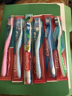 6 Assorted Colgate toothbrushes