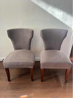 Pair of fabric wingback chairs
