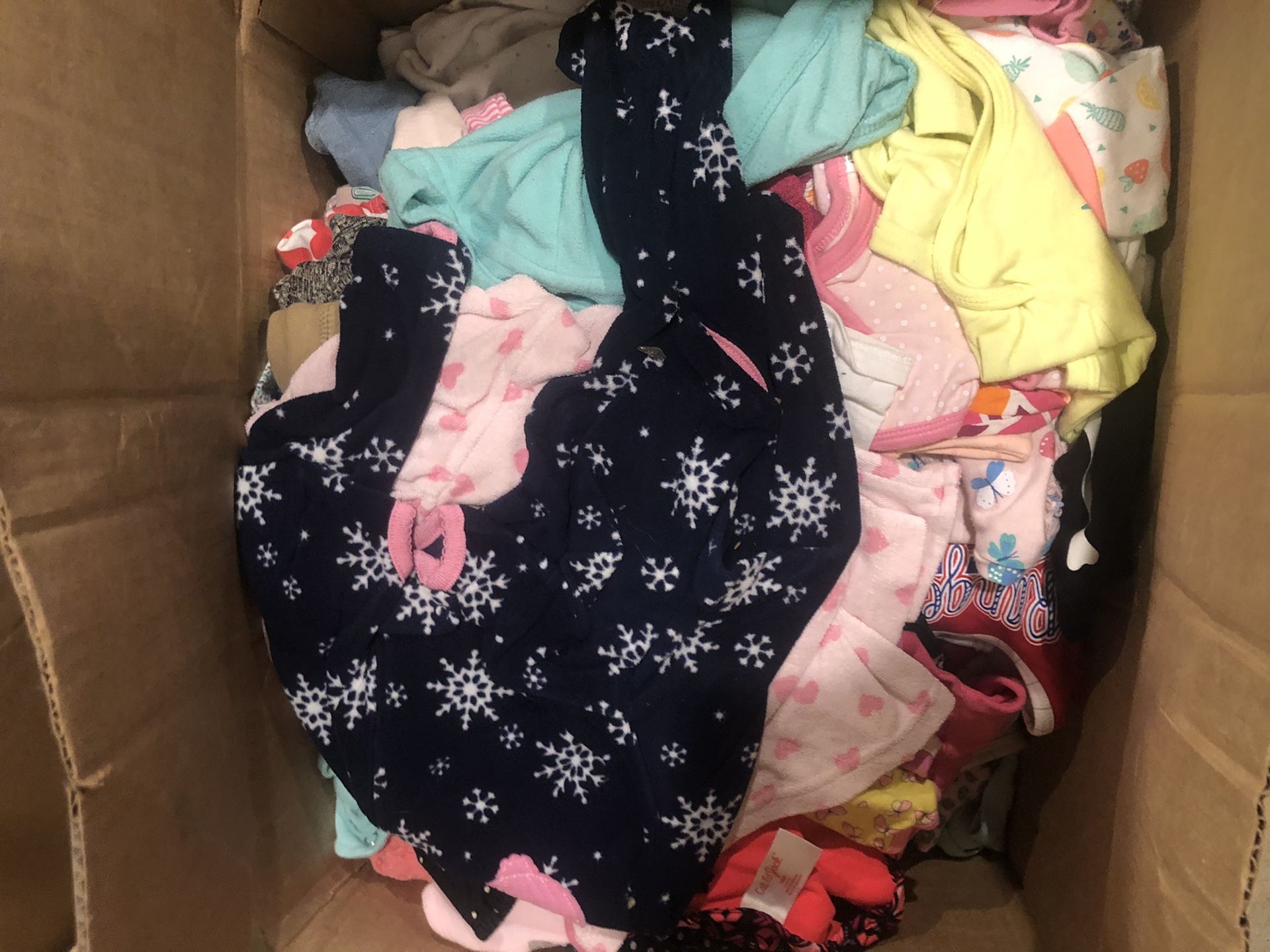 Box of gently used baby girl clothes size newborn to 24 months