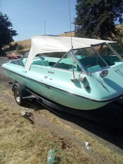 Motorboat with Bimini Top and Teal Interior