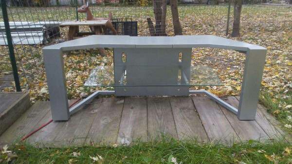 Silver TV stand in good condition one glass Shelf
