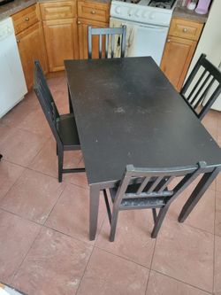 Black dining set: table and four chairs
