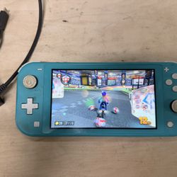 Nintendo Switch Lite With Mario Game And Charger 