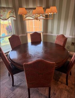 70” Pedestal Dining Table in Mahogany Finish