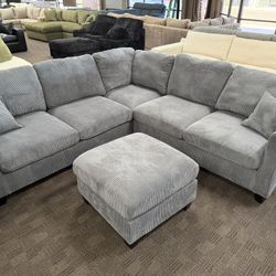 Bluish Gray L Shaped Sectional With Ottoman 