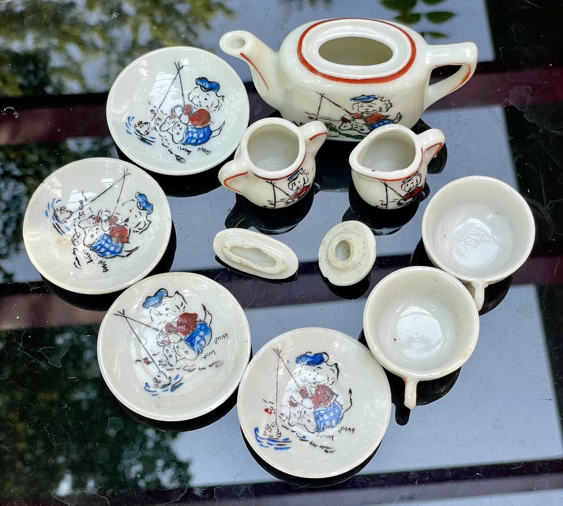 Made in occupied 1940S Porcelain Japan childs tea set with dog fishing