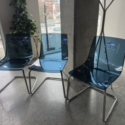 See through blue chairs