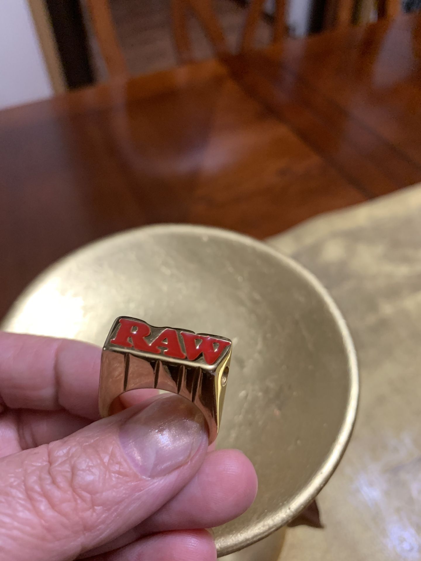 Ring RAW for smoking . Gold plated . Do not know how to measure size.