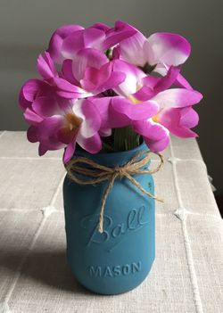 Distressed mason jar with silk flowers $5