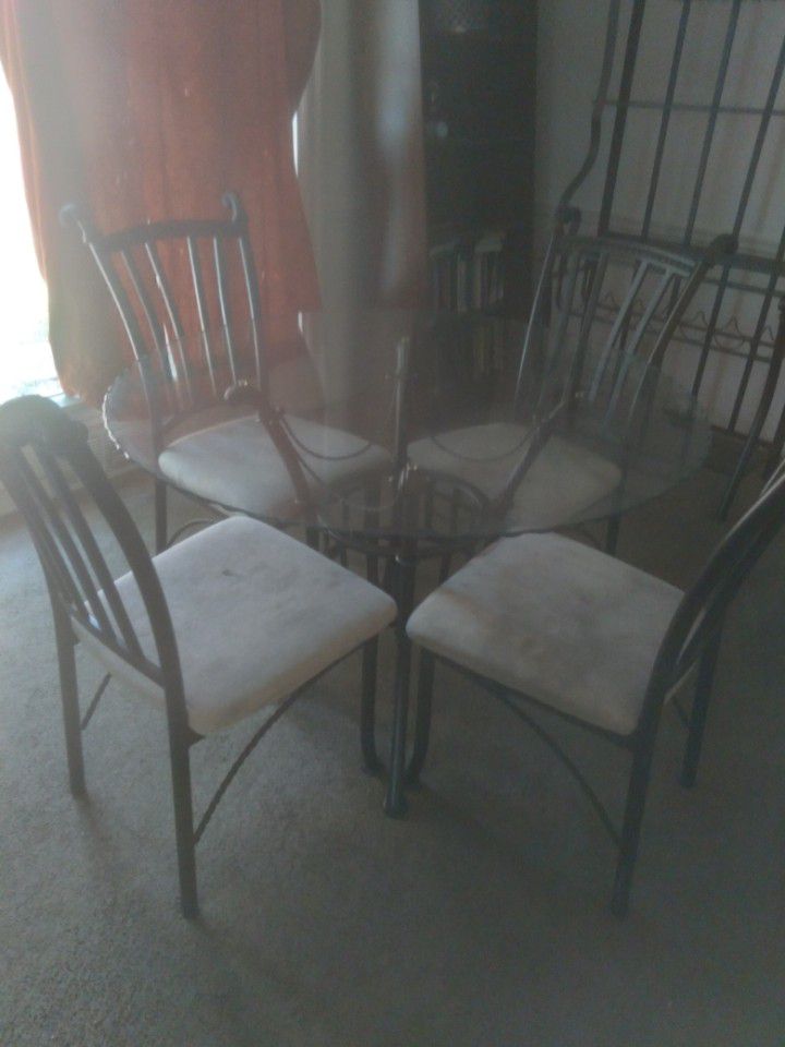 Kitchen table with chairs and bakers rack