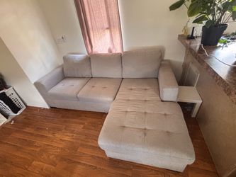 L shaped couch with storage + pull out sleeper