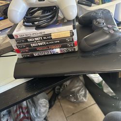 PS3 With Controllers And Game