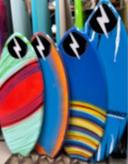 Fiberglass skim boards at Catch a Wave Surf Shop