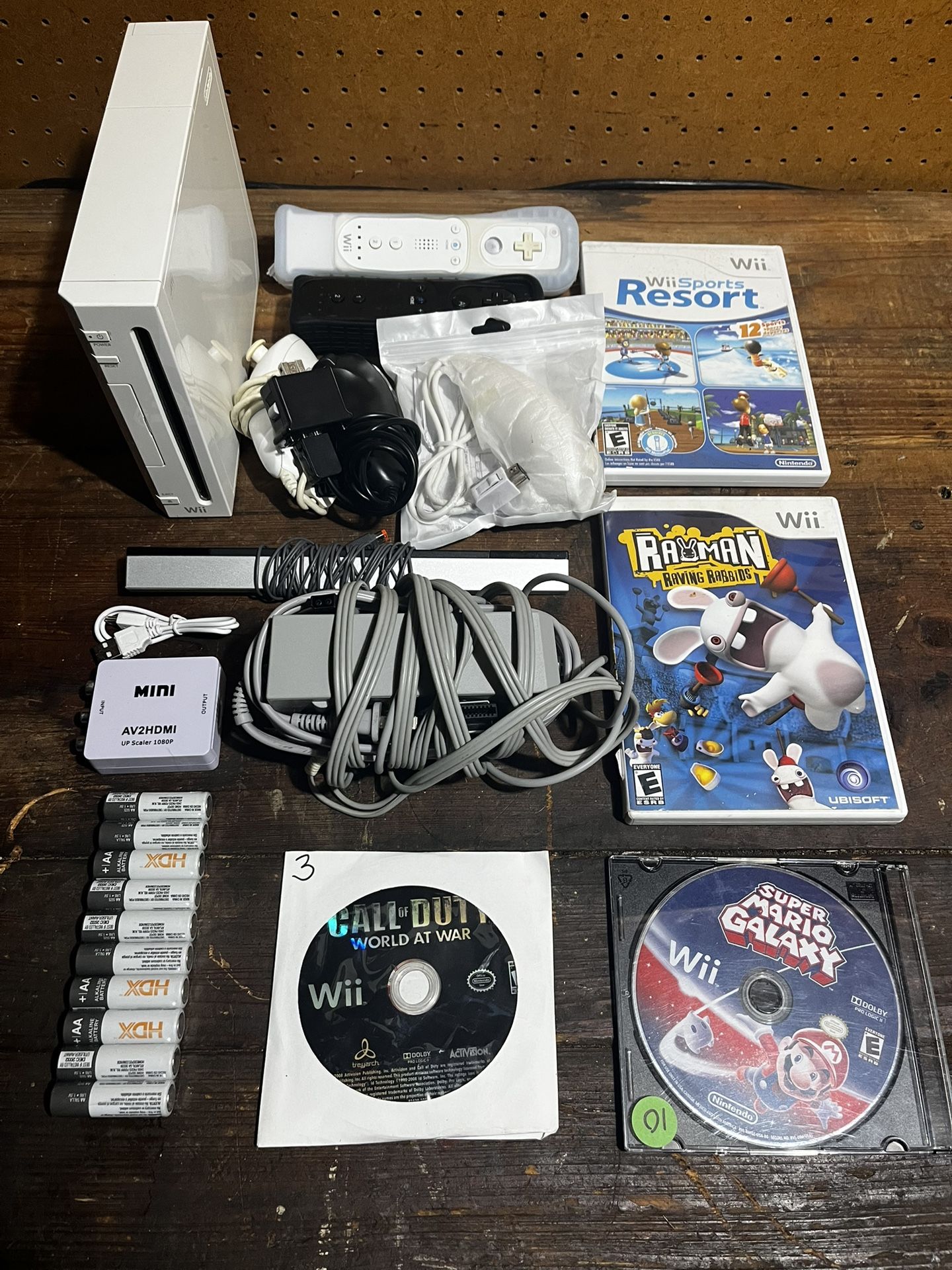 Wii w/ all cables, 2controllers, 3nunchucks, 4 games