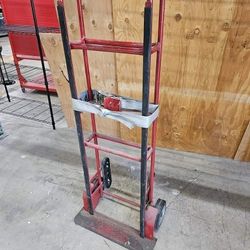 Appliance hand truck with ratchet strap and stair climing treads.

$100