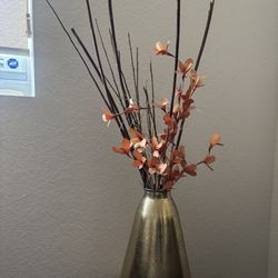 metal vase with flowers 