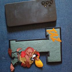 Taz Iron Patches sizes Vary Please Note Cell Phone  In Pictures  Shown To Gauge The Size Of The Patch Buy One For $12.00  Better Pricing For Bulk Buy