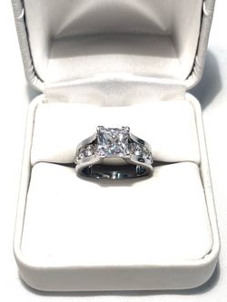 Brand new .925 silver wedding ring with princess cut cubic zirconia C diamonds. Size 5.