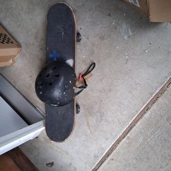 Skate Board With Large Helmet 