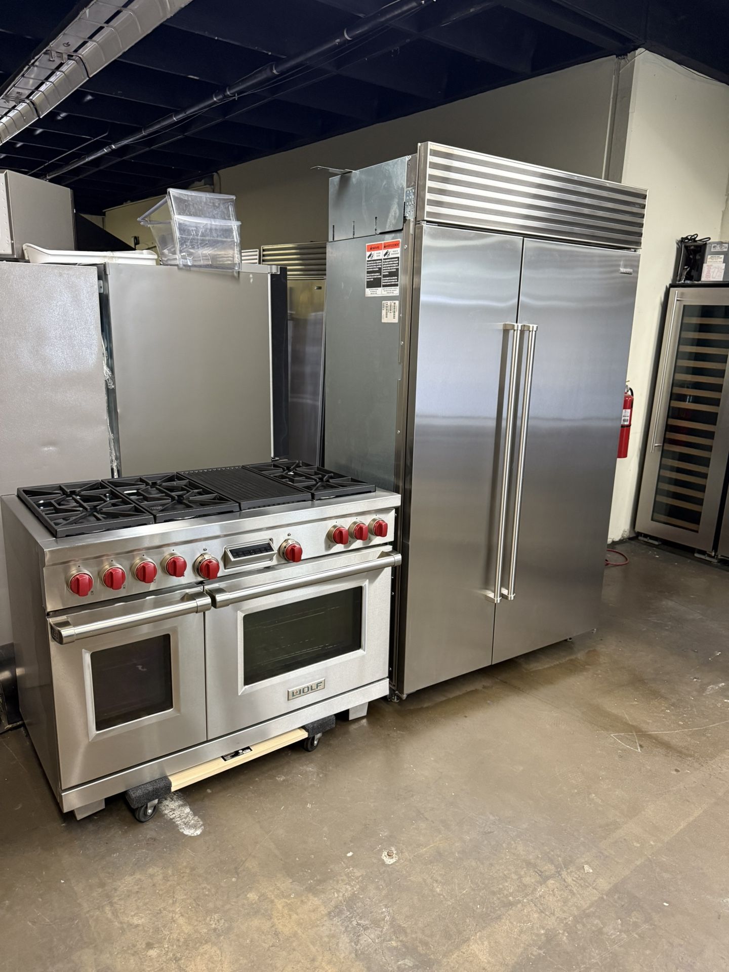 Sub Zero 48” Stainless Steel Built In Refrigerator And Wolf 48” Stainless Steel Dual Fuel Gas Range Kitchen Bundle Set