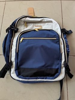 Empsign 40L travel backpack in a white and blue colorway featuring gold-tone zippers and multiple…