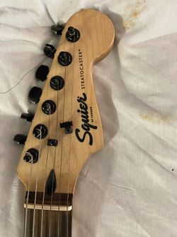 Squire  Stratocaster electric guitar  with components and d distortion