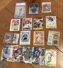 lot of NFL football  cards. Including rookie cards, a Jalen Waddle PSA 10 clear vision rookie card, and Bijan Robinson rookie jersey card