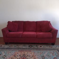 Red sofa with pull out sleeper