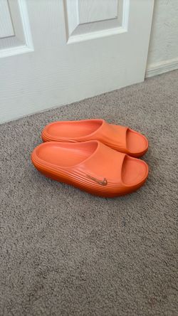 ReactX orange nike slides