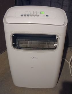 MIDEA PORTABLE A/C , THERE'S A COUPLE OF PIECES MISSING AS YOU CAN SEE BUT OTHER THAN THAT IT WORKS GREAT & COMES WITH REMOTE