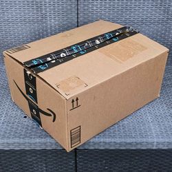 Clean medium size cardboard box with foam packing peanuts for shipping moving or storage